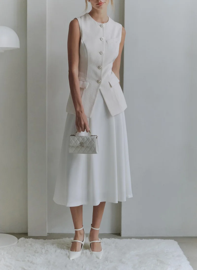 ليتشي صدرية مزودة بأزرار مميزة